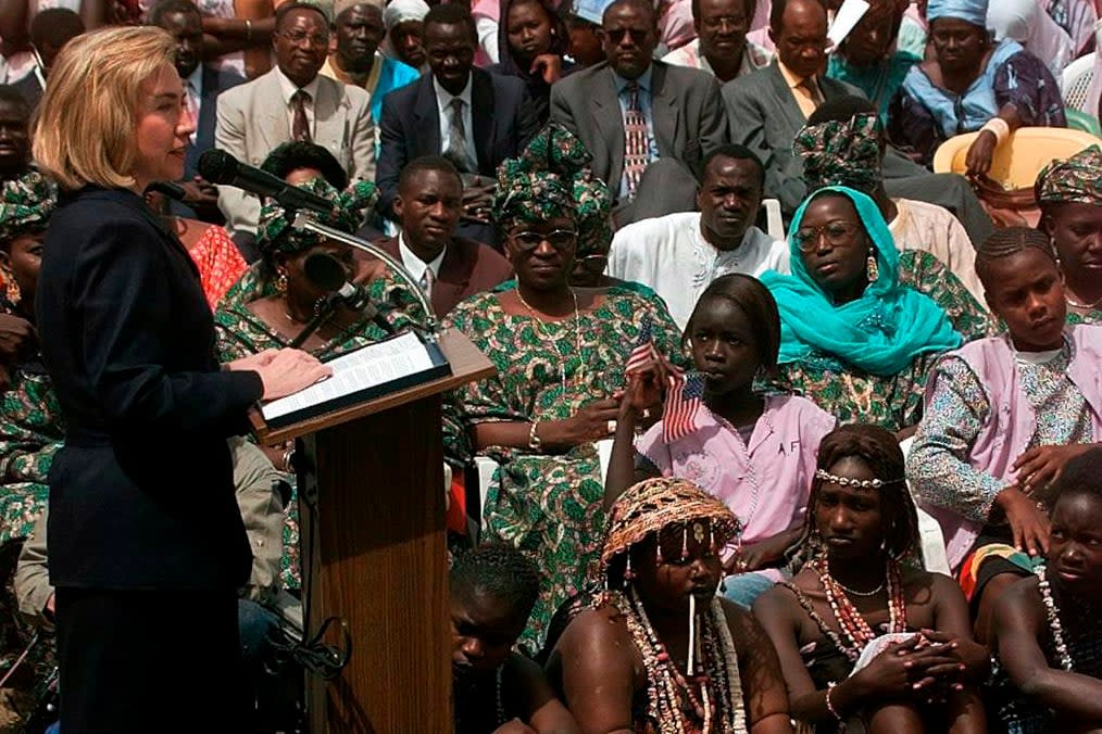 FILE – Then-first lady Hillary Clinton speaks to students and parents of the Martin Luther King Jr. School, an all girls school, in Dakar Senegal, March 17, 1997. (AP Photo/Doug Mills, File)