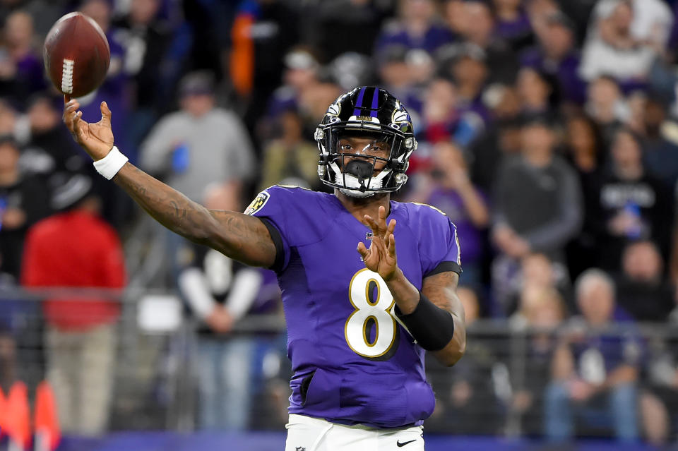 Lamar Jackson #8 of the Baltimore Ravens throws against the Tennessee Titans 