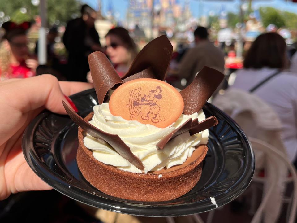 hand holding fancy french silk pie from casey's corner at magic kingdom