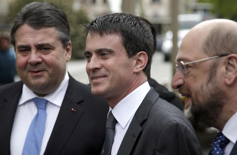 Prime Minister of France Manuel Valls, center, chairman of the German Social Democratic Party, SPD, Sigmar Gabriel, left, and top candidate of the SPD for the European Elections, Martin Schulz, right, arrive for a 100 years World War I remembrance event in Berlin, Germany, Monday, April 14, 2014. (AP Photo/Michael Sohn)