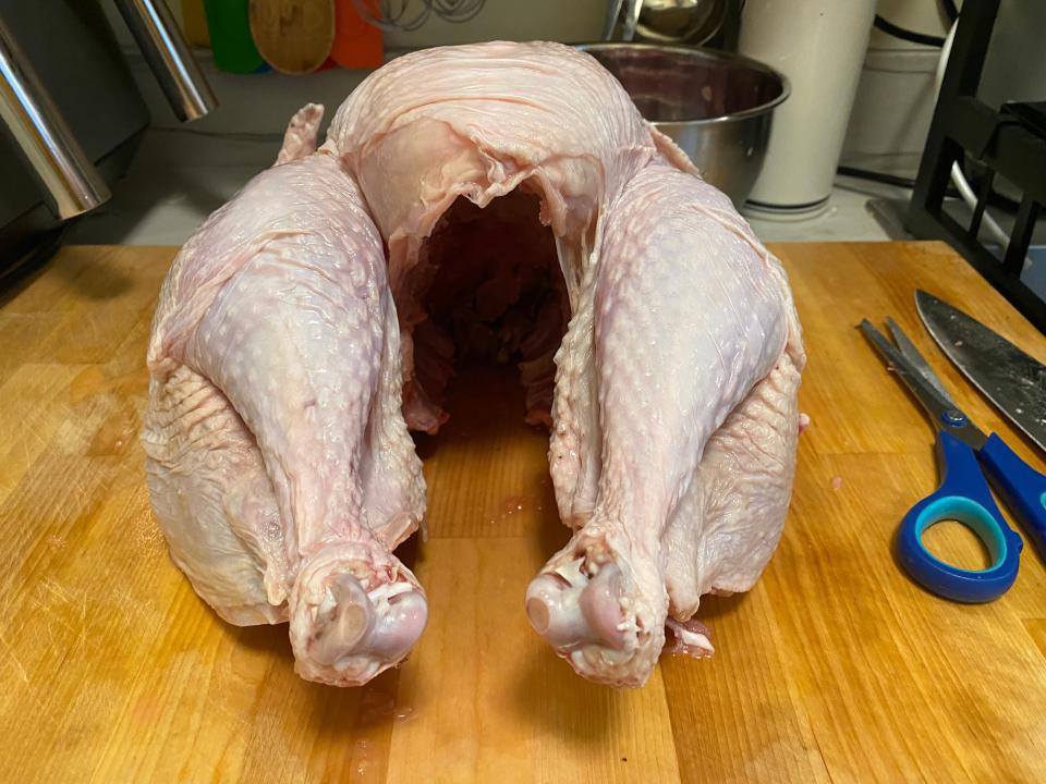 An uncooked turkey scooped out.