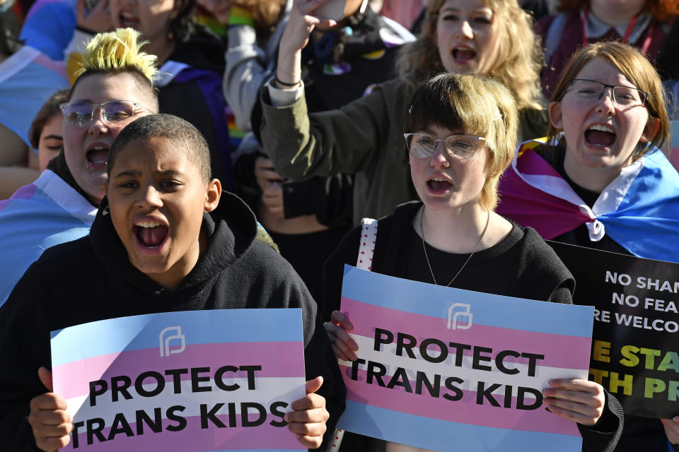 FILE - Protesters of Kentucky Senate Bill SB150, known as the Transgender Health Bill, cheer on speakers during a rally on the lawn of the Kentucky Capitol in Frankfort, Ky., March 29, 2023. Questions over which side was being more compassionate emerged as a key tension as federal appellate judges heard arguments Friday, Sept. 1, 2023, on whether to block transgender youth from receiving gender-affirming care in Kentucky and Tennessee. (AP Photo/Timothy D. Easley, File)