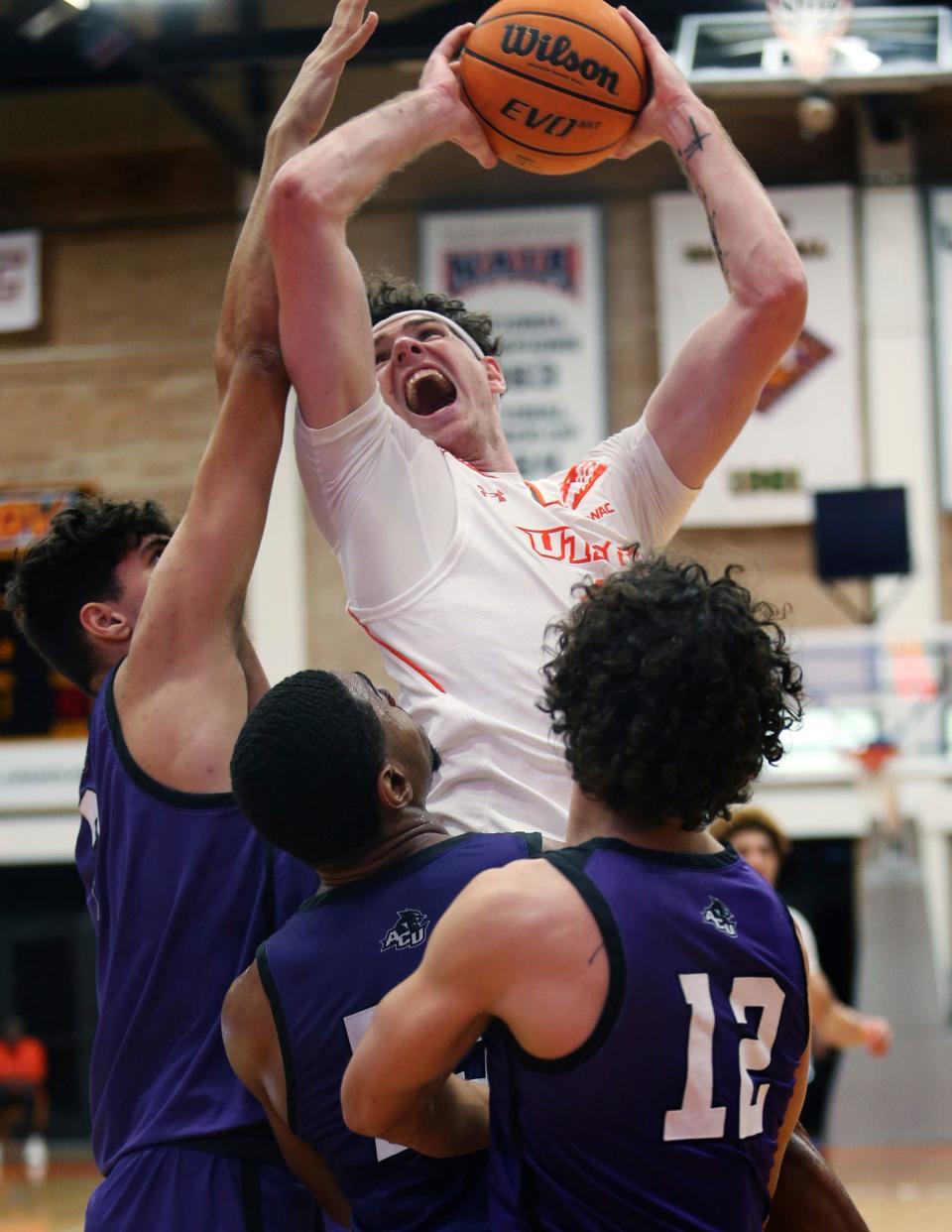 Texas-Rio Grande Valley's Dima Zdor, center, goes up for a rebound against Abilene Christian's Leonardo Bettiol ,left, Immanuel Allen, middle, and Hunter Jack Madden during a Western Athletic Conference game Wednesday in Edinburg.