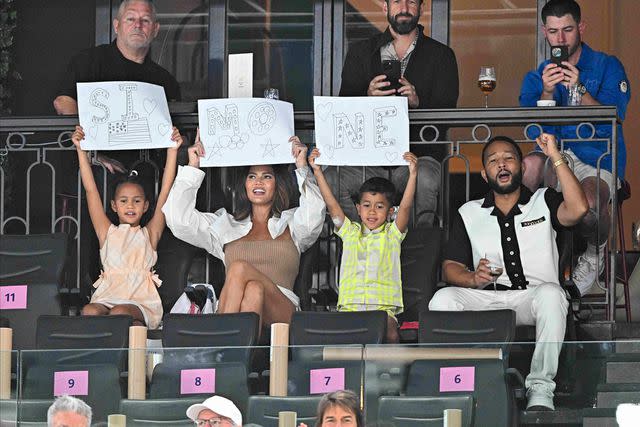 <p>David Niviere/ABACAPRESS.COM/SplashNews.com</p> Chrissy Teigen and John Legend look on with their children as they attend the Olympic Games Paris 2024