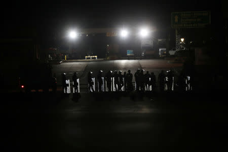 Venezuelan soldiers stand as they block a road at the border between Venezuela and Brazil, in Pacaraima, Roraima state, Brazil, February 22, 2019. REUTERS/Ricardo Moraes