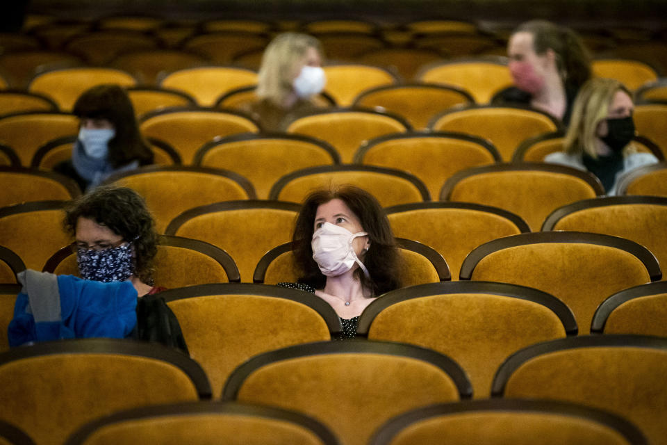 PRAGUE, CZECH REPUBLIC - MAY 11: Customers wearing protective masks sit apart in observance of social distancing measures inside a movie theater as the Czech government lifted more restrictions allowing cinemas to re-open on May 11, 2020, in Prague, Czech Republic. The Czech government has begun further easing the restrictive measures to slow down the spread of the pandemic COVID-19 disease during the lockdown. (Photo by Gabriel Kuchta/Getty Images)