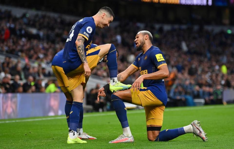 Miguel Almirón celebrates with Joelinton after scoring at Tottenham