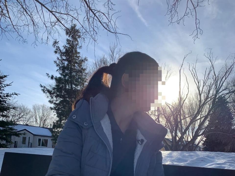 Karamjeet Kaur's family hired a private immigration agent to help her apply to come to Canada as a student in 2018. Years later, CBSA discovered a college admission letter the agent supplied is fake. Kaur now faces removal from Canada. CBC has agreed not to show her face over security concerns.  (Rick Bremness/CBC - image credit)