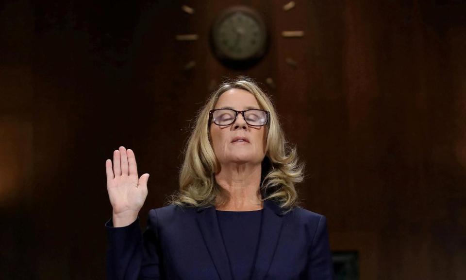 Christine Blasey Ford is sworn in before testifying to the Senate judiciary committee in Washington DC.