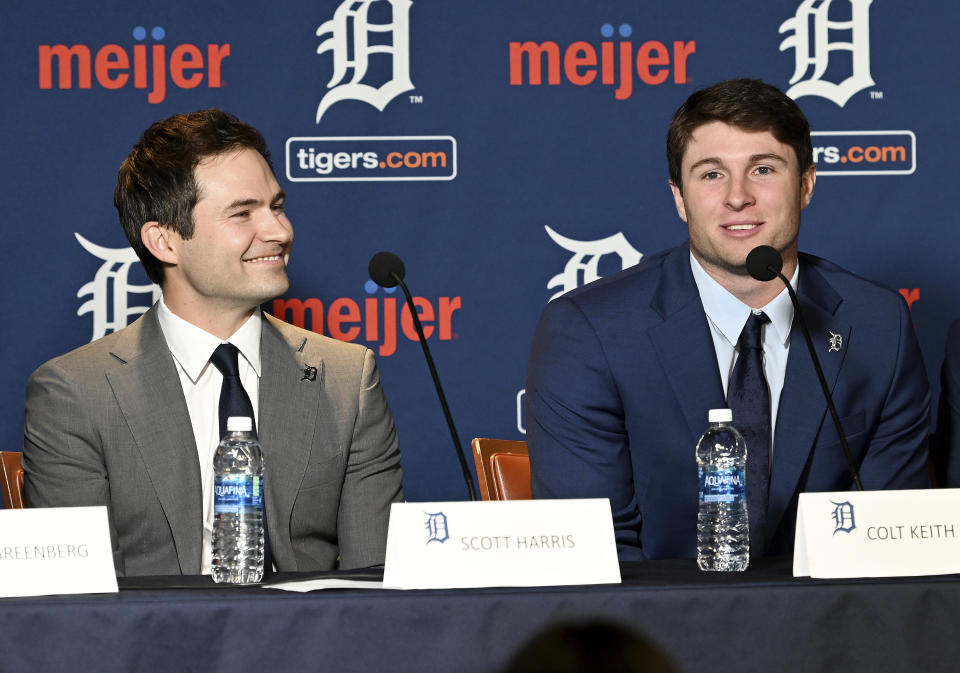 Detroit Tigers president of baseball operations Scott Harris, left, listens as Colt Keith answers a question during a press conference about his contract extension at the MotorCity Casino Hotel Tiger Club in Detroit Tuesday, Jan. 30, 2024. The Detroit Tigers made an unusual bet on a player with no major league experience, agreeing Sunday to a six-year contract with the 22-year-old that guarantees the infield prospect $28,642,500. (Robin Buckson/Detroit News via AP)