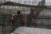 Workers work at a construction site, following the COVID-19 outbreak, in Shanghai