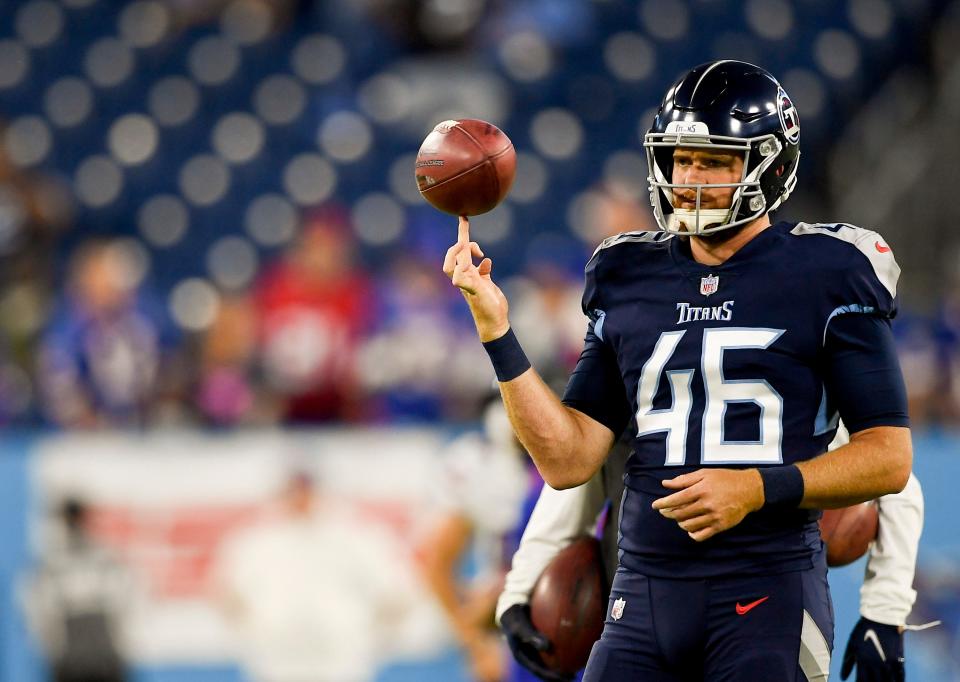 Tennessee Titans long snapper Morgan Cox (46) spins a ball on his finger during warm ups at Nissan Stadium Monday, Oct. 18, 2021 in Nashville, Tenn. 