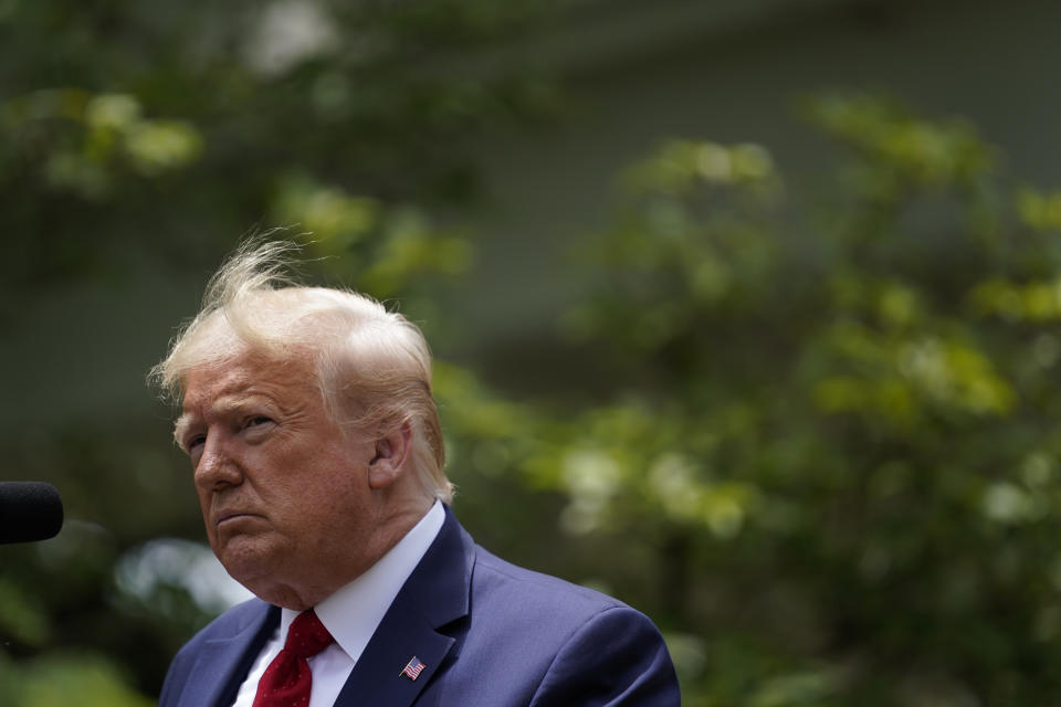 FILE - In this June 16, 2020, file photo President Donald Trump speaks during an event on police reform, in the Rose Garden of the White House in Washington. Americans are deeply unhappy about the state of their country, and a majority think Trump is doing more to divide the nation than unite it, according to a new poll from The Associated Press-NORC Center for Public Affairs Research. (AP Photo/Evan Vucci, File)