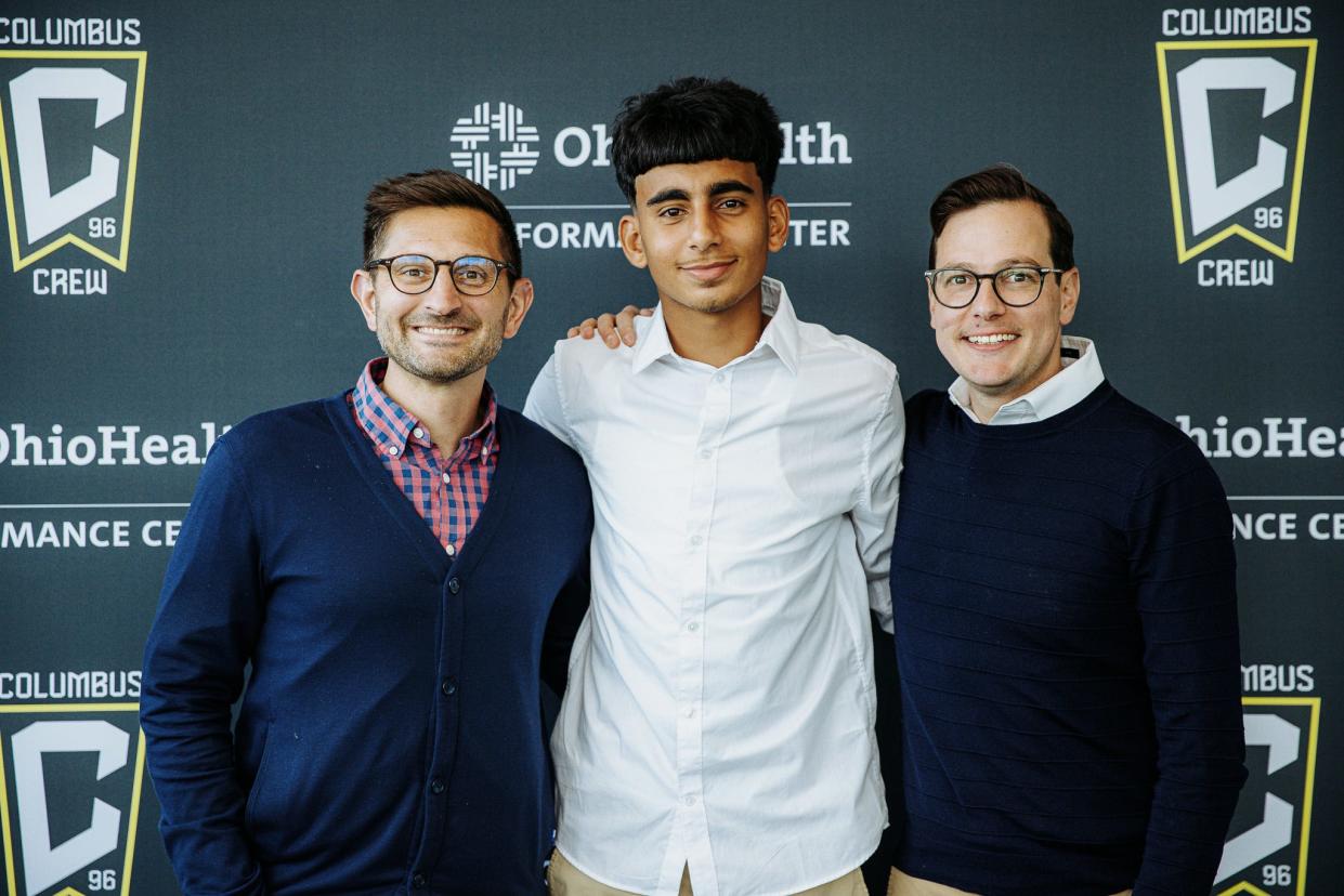 Midfielder Taha Habroune, pictured with Crew general manager Tim Bezbatchenko (left) and Crew 2 general manager Corey Wray, signed with Crew 2 as the third player to join Crew 2 directly from the Crew Academy.