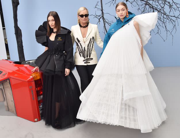 Stephane Cardinale - Corbis/Corbis via Getty Bella Hadid, Yolanda Hadid and Gigi Hadid backstage at the Off-White fall/winter 2020 show on Feb. 27, 2020