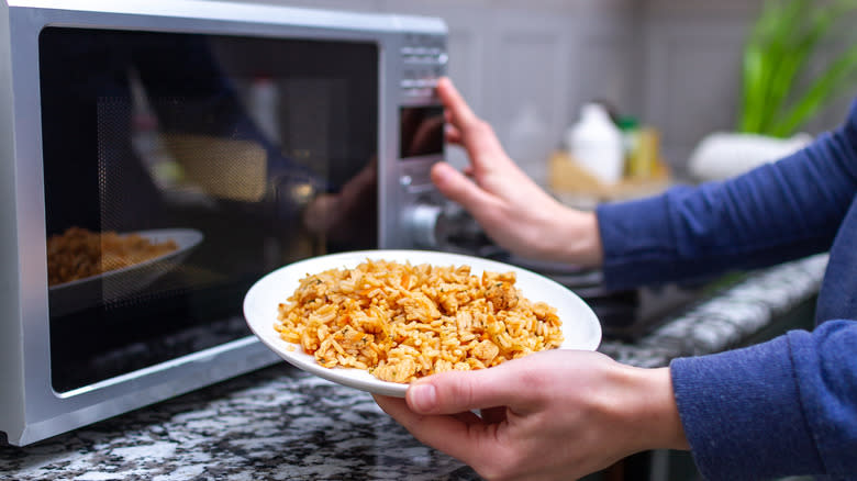 Person using microwave