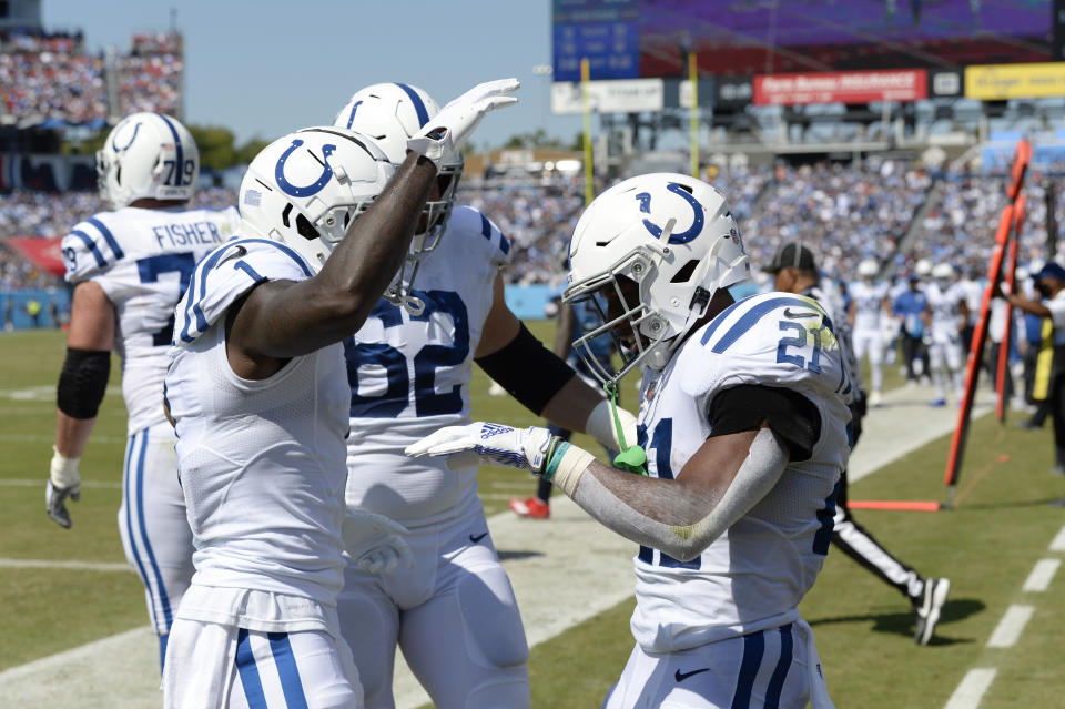 Indianapolis Colts running back Nyheim Hines (21) celebrates with Parris Campbell (1) after Hines scored a touchdown against the Tennessee Titans in the first half of an NFL football game Sunday, Sept. 26, 2021, in Nashville, Tenn. (AP Photo/Mark Zaleski)