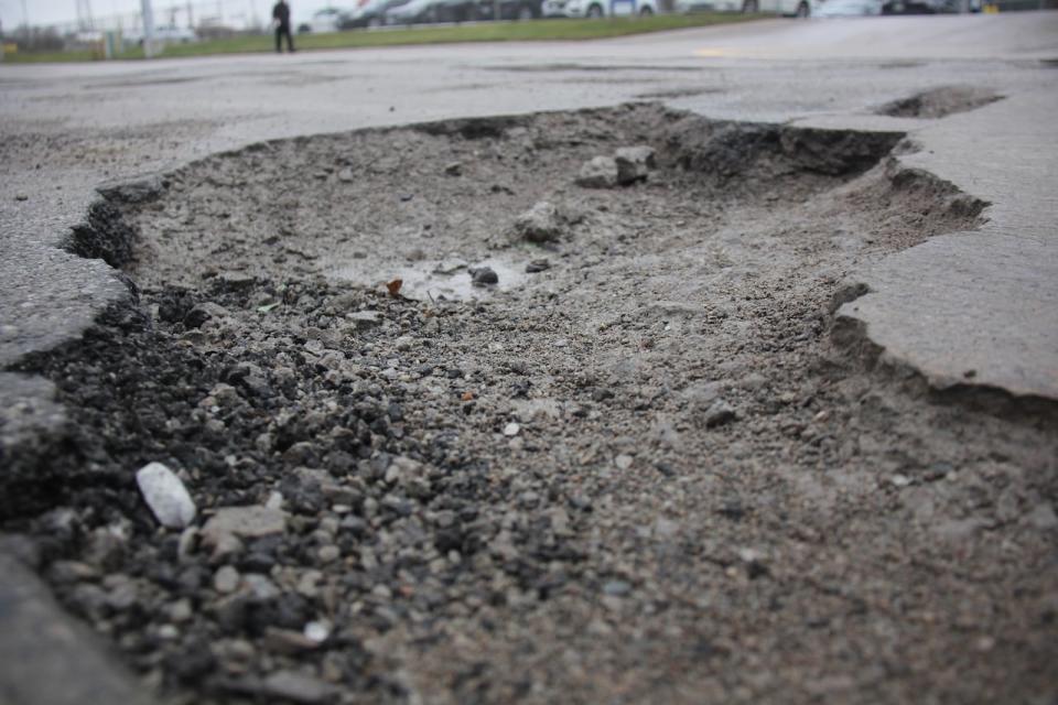 A massive pothole in Windsor. More than 400 pothole complaints have been made to 311 in January alone. (Michael Evans/CBC - image credit)