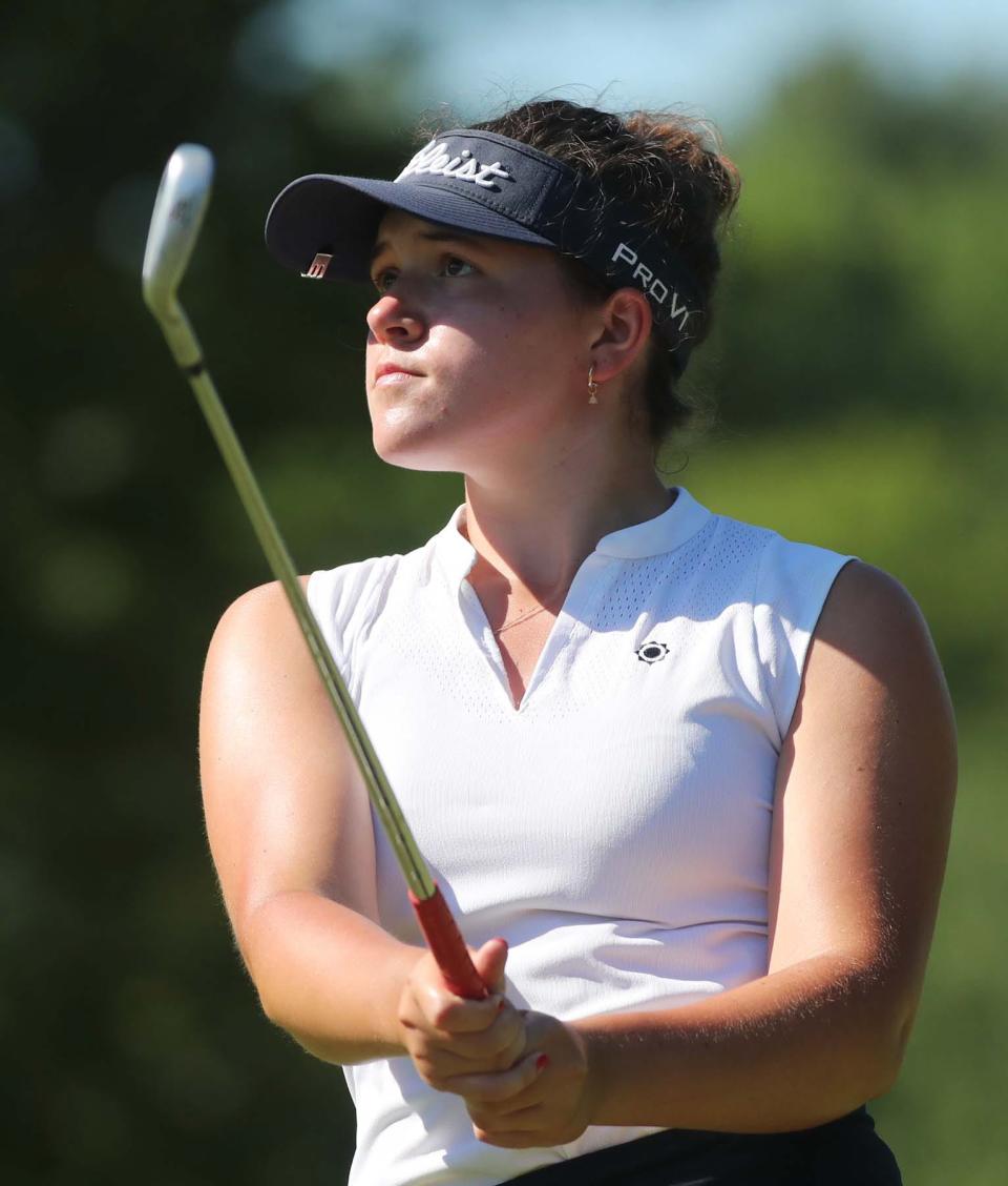 Isabella Goyette of Medina watches her tee shot during the Hudson Junior Golf Tournament at the Country Club of Hudson on Thursday. She tied for fourth place in the tournament.