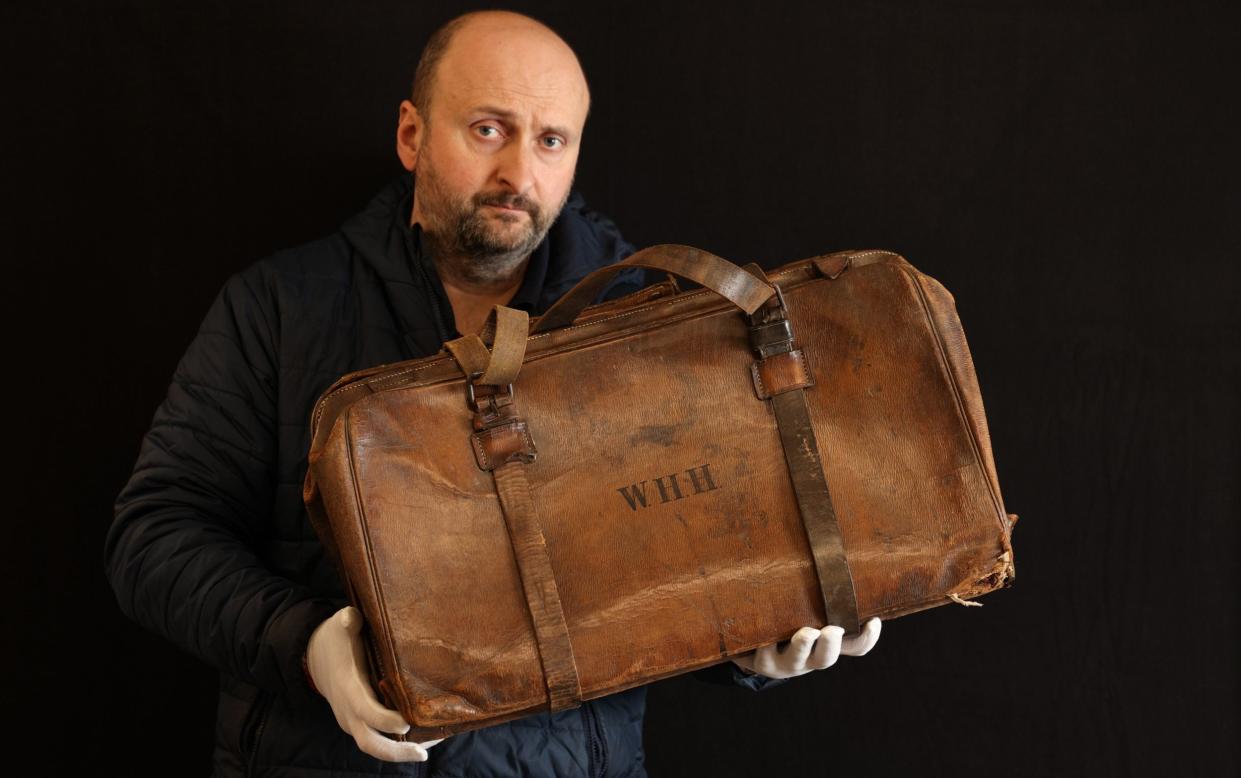 Auctioneer Andrew Aldridge with violin case that Wallace Hartley strapped to his body as the Titanic sunk in 1912