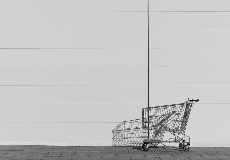 Shopping cart by the side of a building