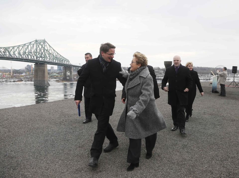 Parti Quebecois leader Pauline Marois (C) leaves a campaign stop in Montreal April 2, 2014. Quebec voters will go to the polls in a provincial election April 7. REUTERS/Christinne Muschi (CANADA - Tags: POLITICS ELECTIONS)