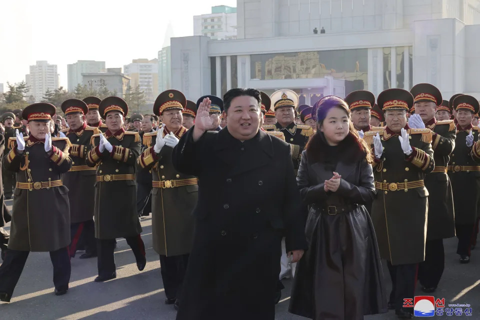 In this photo provided by the North Korean government, its leader Kim Jong Un, center, with his daughter, waves as he visits the defense ministry during an event for the 76th founding anniversary of the country's army in North Korea, Thursday, Feb. 8, 2024. Independent journalists were not given access to cover the event depicted in this image distributed by the North Korean government. The content of this image is as provided and cannot be independently verified. Korean language watermark on image as provided by source reads: "KCNA" which is the abbreviation for Korean Central News Agency. (Korean Central News Agency/Korea News Service via AP)