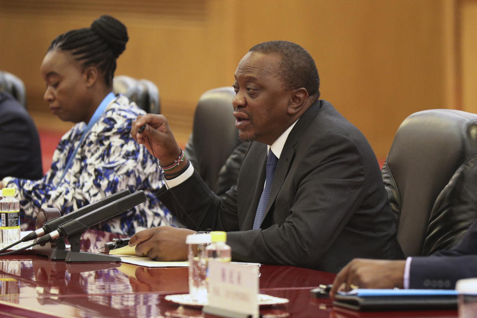 Kenyan President Uhuru Kenyatta, center, talks with with Chinese President Xi Jinping, unseen, during the meeting at the Great Hall of the People in Beijing, China Thursday, April 25, 2019. (Kenzaburo Fukuhara/Pool Photo via AP)