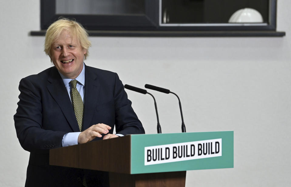 Britain's Prime Minister Boris Johnson listens to a question, during a visit to Dudley College of Technology in Dudley, England, Tuesday June 30, 2020. Johnson promised an infrastructure investment plan to help the U.K. fix the economic devastation caused by the pandemic. (Paul Ellis/Pool Photo via AP)