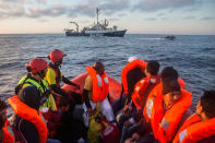 <p>Refugees and migrants transferred to Sea Watch organization’s ship during a rescue operation on the Mediterranean sea, about 19 miles north of Az Zawiyah, Libya, on Thursday, July 21, 2016. Over the past weeks, vessels from NGOs, several nations’ military fleets and passing cargo ships have all rescued migrants from unseaworthy boats launched from Libya’s shores. (AP Photo/Santi Palacios) </p>