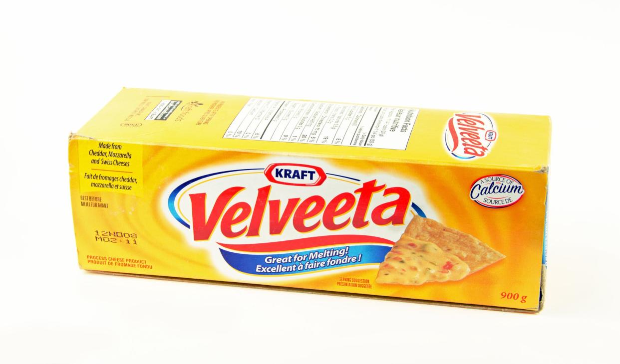 Bruce, Canada- July 23, 2012: A large box of Velveeta cheese showing the front of the box, which has been opened. The image is vertical so it can be read. Velveeta is a processed cheese produce by Kraft.