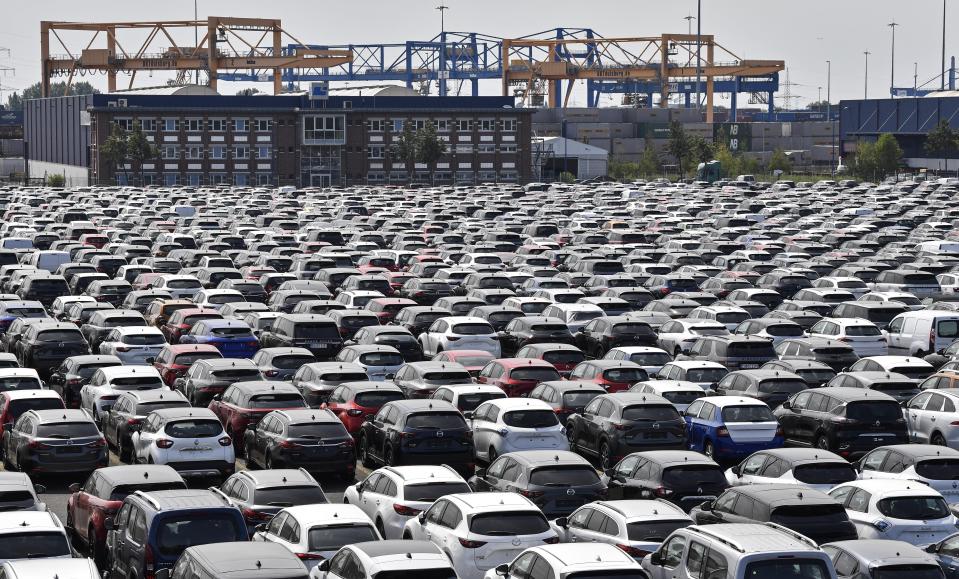 New cars are stored at the 'logport' (logistic port) in Duisburg, Germany, Wednesday, June 3, 2020. The car industry is expecting help by the German government because ot the economy crisis due to the coronavirus pandemic. (AP Photo/Martin Meissner)