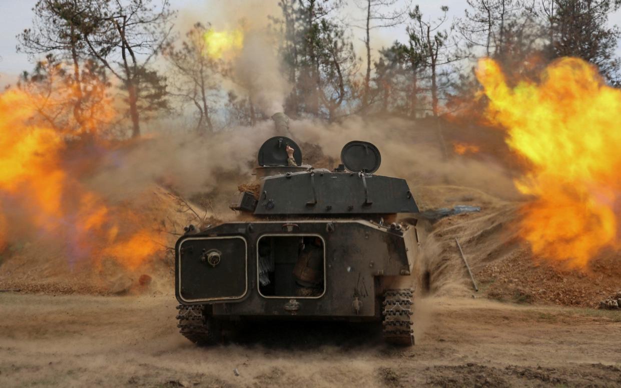 Ukrainian service members of the 37th Marine Brigade fire a 2S1 Gvozdika self-propelled howitzer toward Russian troops, amid Russia's attack on Ukraine, in a front line in Southern Ukraine, March 30, 2024.