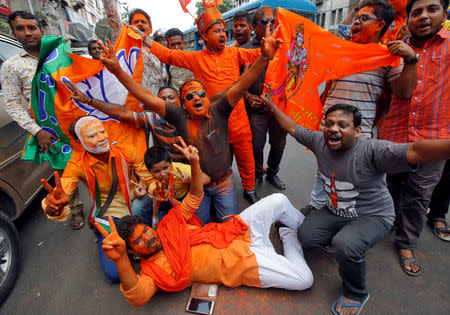 Supporters of Bharatiya Janata Party (BJP) celebrate after learning initial poll results in Kolkata, India, May 23, 2019. REUTERS/Rupak De Chowdhuri