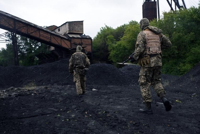 Pro-Russian militants patrol in an old coal mine on July 8, 2014 after an air strike in Donetsk, eastern Ukraine