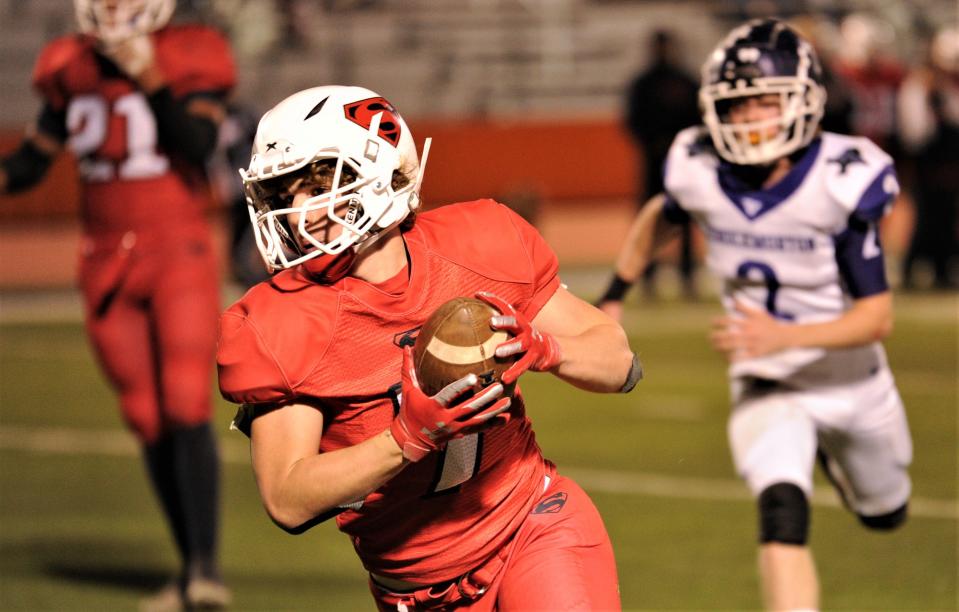 Strawn's Griff Rigdon runs with the ball as Throckmorton's Carson Myer chases him on Friday, Nov. 19. Strawn outscored opponents 199-31 in its first three playoff games.