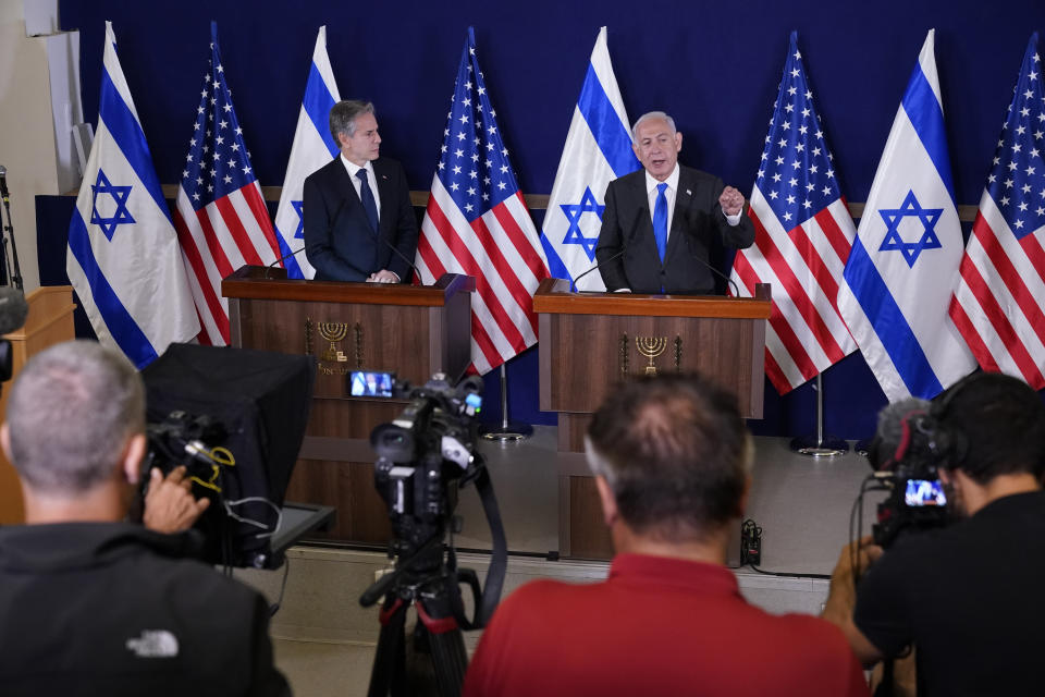 FILE - Israel's Prime Minister Benjamin Netanyahu, right, make statements with Secretary of State Antony Blinken to the media, inside The Kirya, which houses the Israeli Ministry of Defense, after their meeting in Tel Aviv, Oct. 12, 2023. AP Washington photographer Jacquelyn Martin recalls how being one of a few female photographers covering news and politics was useful when she was assigned as the press pooler for Blinken's last-minute trip to Israel and the Middle East in the aftermath of the Hamas attacks. Martin said, “Sometimes people not knowing what to make of you works in your favor.” (AP Photo/Jacquelyn Martin, Pool, File)