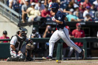 Mississippi's Justin Bench (8) scores a run in the fourth inning against Mississippi during an NCAA College World Series baseball game Thursday, June 23, 2022, in Omaha, Neb. (AP Photo/John Peterson)