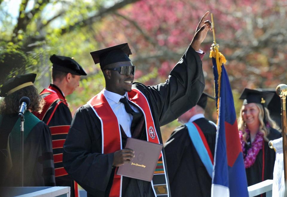 Nathaniel Duncan, of Boston, celebrates after receiving his degree during the Eastern Nazarene College graduation in Quincy on Saturday, May 6, 2023.
