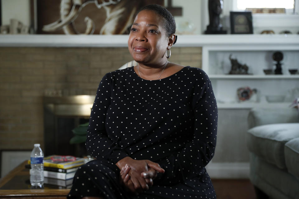 In this July 29, 2019, photo, Felicia Pulliam speaks during an interview at her home in Normandy, Mo. Pulliam, a longtime advocate for racial equity and unity, was among the two dozen people appointed to the Ferguson Commission in the wake of the unrest that followed Michael Brown's death. (AP Photo/Jeff Roberson)