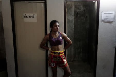 Muay Thai boxer Nong Rose Baan Charoensuk, 21, who is transgender, waits before her boxing match at the Rajadamnern Stadium in Bangkok, Thailand, July 13, 2017. REUTERS/Athit Perawongmetha