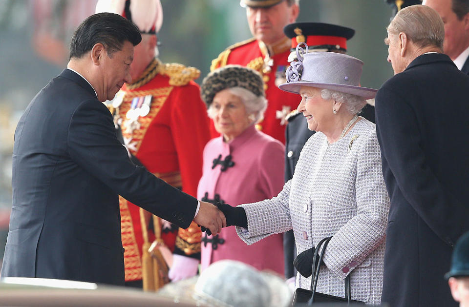 Queen Elizabeth II shakes hands with Chinese President Xi Jinping on Horseguards Parade during the Official Ceremonial Welcome for the Chinese State Visit on Oct. 20, 2015 in London, England.<span class="copyright">Chris Jackson—WPA Pool /Getty Images</span>