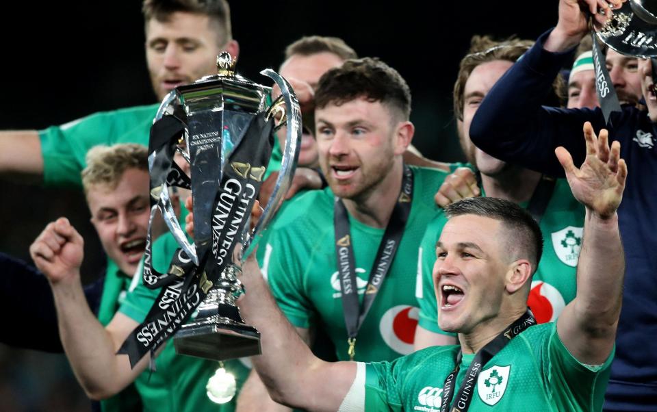 Ireland celebrate Grand Slam win - AFP/Paul Faith