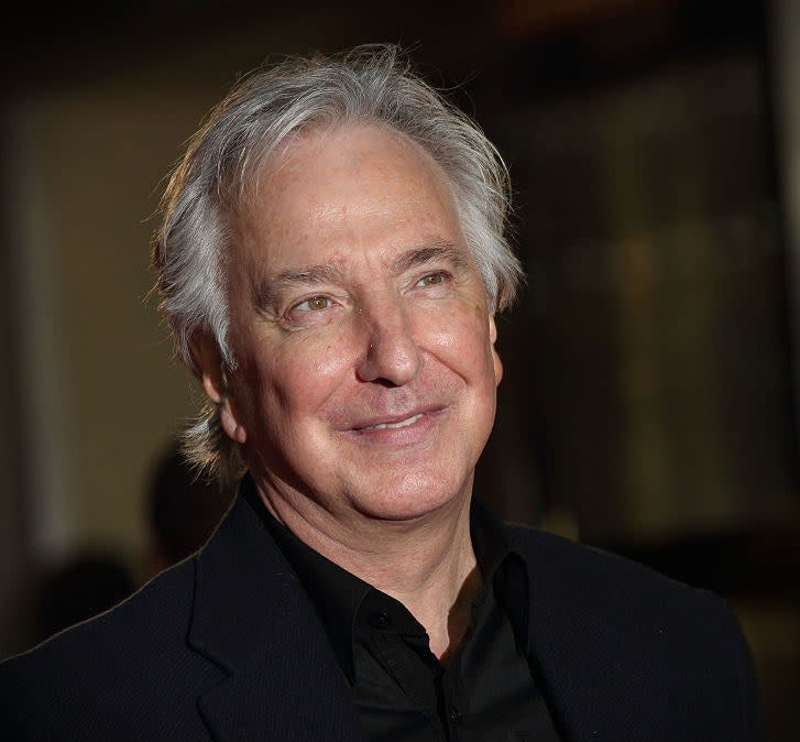 Alan Rickman at an event, smiling