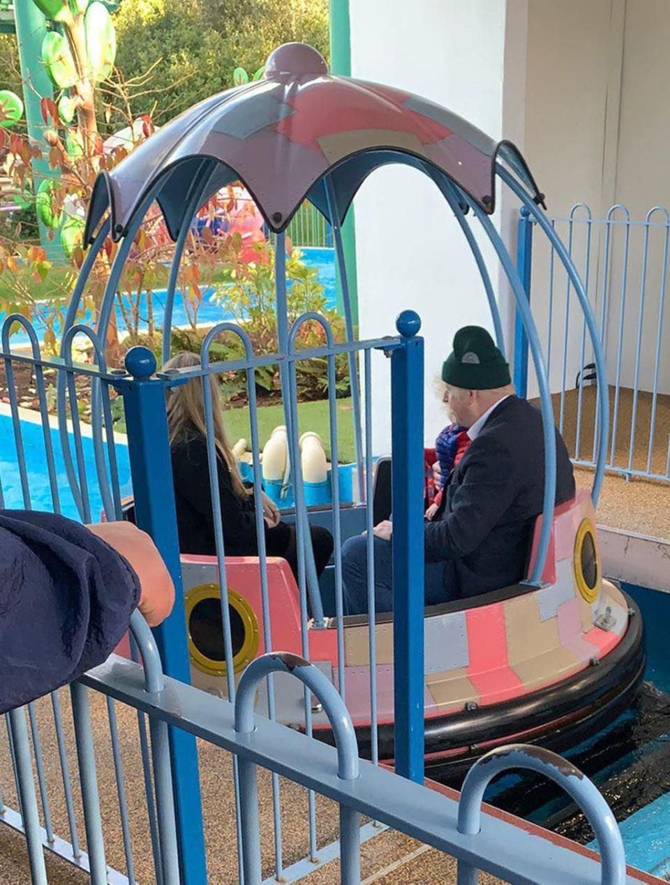 Farhadul Azhar Tipu taking a selfie next to Boris Johnson at Peppa Pig World in Hampshire (Farhadul Azhar Tipu/PA Wire)