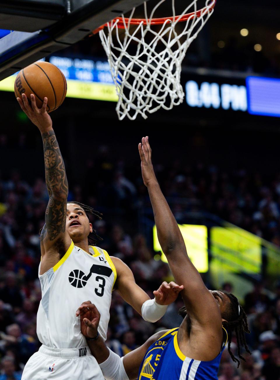 Utah Jazz guard Keyonte George (3) shoots the ball with Golden State Warriors forward <a class="link " href="https://sports.yahoo.com/nba/players/5490/" data-i13n="sec:content-canvas;subsec:anchor_text;elm:context_link" data-ylk="slk:Kevon Looney;sec:content-canvas;subsec:anchor_text;elm:context_link;itc:0">Kevon Looney</a> (5) on defense during the NBA basketball game between the Utah Jazz and the Golden State Warriors at the Delta Center in Salt Lake City on Thursday, Feb. 15, 2024. | Megan Nielsen, Deseret News