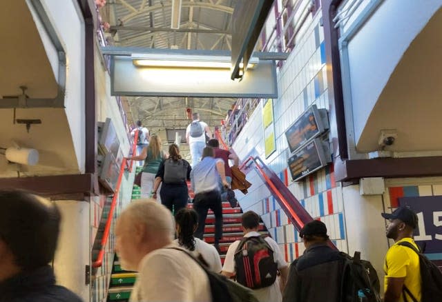 People running through Clapham Junction station