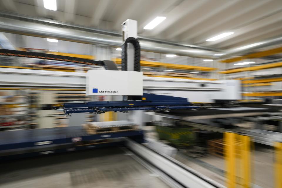 An automatic machine works on the portions that make up the pool at the Myrtha Pools factory, in Castiglione delle Stiviere, northern Italy, Tuesday, March 12, 2024. Italian company Myrtha Pools is producing 24 pools for the Paris Olympics at its factory in Castiglione delle Stiviere, near Verona. The pools will be used for swimming, diving, water polo, artistic swimming and training areas in Paris. It's the sixth Olympics that Myrtha will be providing pools for. (AP Photo/Luca Bruno)