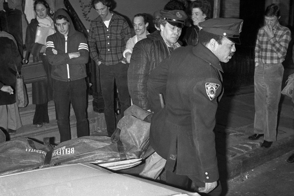 FILE - In this Feb. 2, 1979 file photo, New York City police carry the body of punk rock singer Sid Vicious from an apartment in the Greenwich Village area of New York. Authorities said that Sid Vicious, whose real name was John Simon Ritchie, apparently died of an overdose of heroin he took at a party celebrating his release from prison the day before. He had been released on $50,000 bail pending trial in the fatal stabbing of his girlfriend Nancy Spungen. (AP Photo/G. Paul Burnett)