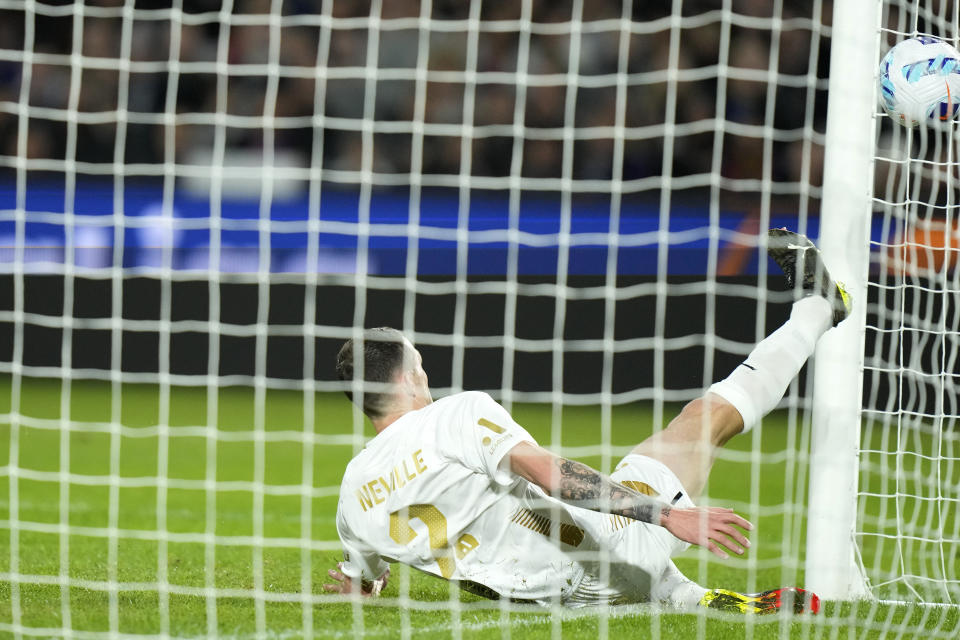 A-Leagues All Stars' Scott Neville is unable to defend a scoring shot by Barcelona's Adamants Traore during their friendly soccer match in Sydney, Australia, Wednesday, May 25, 2022. (AP Photo/Rick Rycroft)